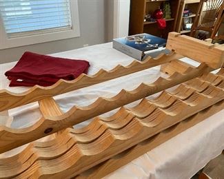 Wine rack? Several blocks with notches match wavy boards