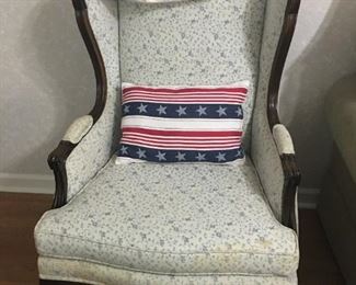 wing back chair with decorative pillow