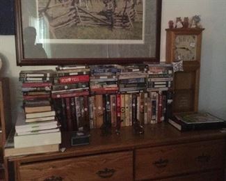 various books on oak dresser with clock and assortment items with civil war print