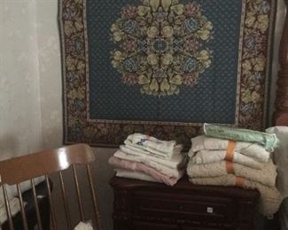 wall tapestry with rocking chair and linens