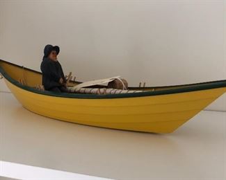 Wood carved yellow boat