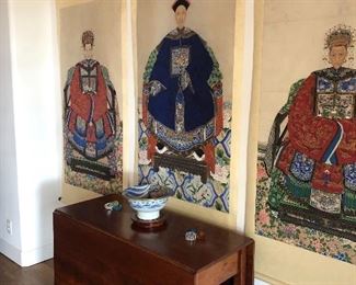 set of 3 Chinese Qing Ancestors, 19th Century Pigments, ink on paper, each mounted on individual hanging scrolls.  2 females flanking male figure in formal mandarin style robes with rank badges and headdresses, seated on a throne covered in ornate textiles resting on pedastles on top of richly decorated carpets. Each measures appx 5'7" X 2'8" (please note a similar ancestor was sold by Christies in 2011 for $6205)   - table is not for sale