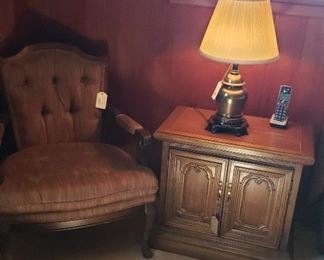 upholstered arm chair, night stand, lamp