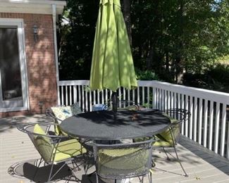 Iron table with 5 chairs, cushions and pillows. Also includes matching umbrella! In excellent condition! Table: 53 1/2 x 28 1/2 Chairs: 20 x 17 x 31” https://ctbids.com/#!/description/share/949851
