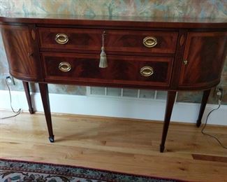 This is a gorgeous burled and inlaid wood sideboard with two drawers, one having a place for silver. Owner states it came from Andrews Gallery and it is a Maitland Smith. It measures 68"x18"x37". https://ctbids.com/#!/description/share/949852