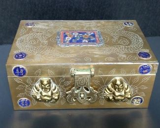 This box appears to be hand carved brass with a rough cloisonne style enameling. It is beautifully done. It measures approximately 9"x6"x4". https://ctbids.com/#!/description/share/949857