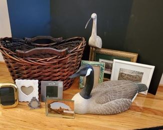 Large Goose is made of a resin type material and is 22" long. Crane is made of wood and metal and is 22" tall. He broke his neck but he got it fixed. Basket 23x15", various picture frames and some cute wooden apples.  https://ctbids.com/#!/description/share/949892