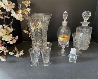 Vase, decanters, and a variety of drinking glasses. Sneak suspicion that the vase is Waterford but can’t confirm. https://ctbids.com/#!/description/share/949925