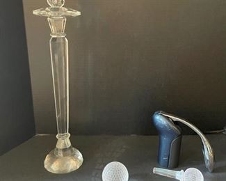 Tiffany & Co golf ball, beautiful candlestick, wine bottle opener and a decanter top. https://ctbids.com/#!/description/share/949927