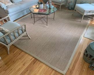 This is a wicker woven floor rug with the edges stitched with a heavy duty canvas material. It’s very rugged and feels well made. Does have some signs of wear on it. 121x96. Rug pad included.  https://ctbids.com/#!/description/share/949922