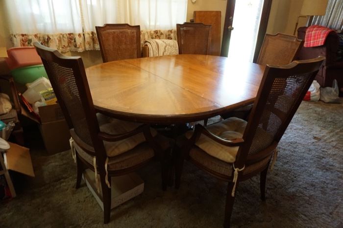 DINNING TABLE, 2 LEAVES,PADS, 6 CAPTAINS CHAIRS, TABLECLOTHS AND NAPKINS