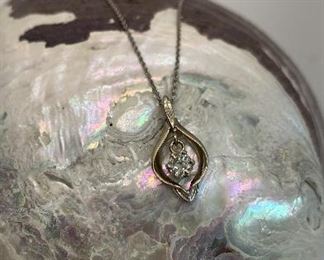 14K white Gold Open Pendant with .25 carat diamond. Appraisal included. Appraised at $1338.00 we are offering for $600