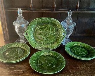 Item 139:  (2) Glass Covered Urns (right & left) - 10":  $24                                                                                                            Item 140:  (5) Majolica Cabbage Plates:  $48/Set (SOLD)                                                                                                     Item 141:  Majolica Cabbage Serving Plate (middle):  $55