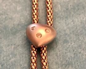 Item 293:  4.8 Grams...White gold and diamond hearts necklace:  $265.00