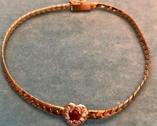 Item 265:  14K with Ruby Surrounded by Small Diamonds:  $275