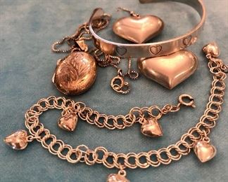 Item 407:  Sterling Silver Cuff Bracelet: $45                                            Item 408:  Heart Earrings: $35                                                                        Item 409:  Sterling Locket: $35                                                                         Item 410:  Sterling Silver Bracelet with Hearts: $35 (SOLD)