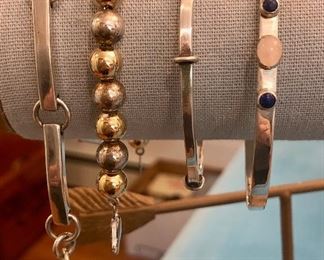 Item 400:  Sterling Silver Bangle Bracelet with Stones:  $48                                                                                                            Item 401:  Sterling Bangle: $48                                                                      Item 402:  Sterling Bead Bracelet: $38                                                         Item 403:  Heavy Sterling Link Bracelet: $75