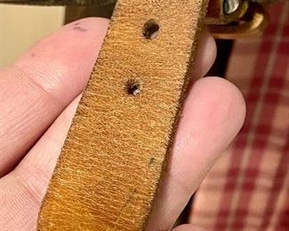 detail - some wear to leather strap as well