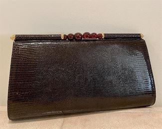Item 498:  Gucci Brown Leather Clutch:  $210