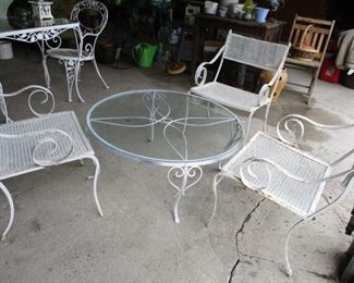 round iron table with glass top & 3 armchairs