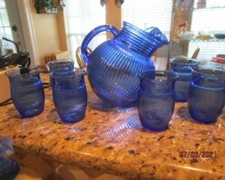 Blue pitcher and small glasses