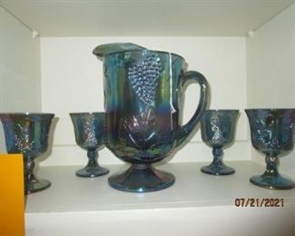 Blue Carnival Glass with 8 glasses. 