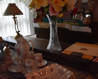 adding to the Picture is this Beautiful Cut Glass Flower Vase and Student Lamp all sitting atop a Baby Grand Piano originally owned by the person who wrote the Famous Song, "Near Me". All documentation of this will go with the person who purchases the piano.
