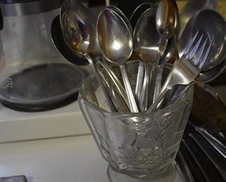 Close up of Antique Spooner with Spoons
