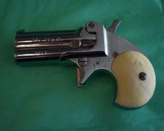 Derringer Cal. 22 LR made in Italy, markings include the no. 35800, and the Roman Numerals XIX bordered on each side the left with a shield with star above and the right side with the letters PSF with the star above.