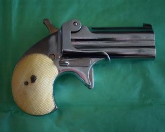 Derringer Cal. 22 LR made in Italy, markings include the no. 35800, and the Roman Numerals XIX bordered on each side the left with a shield with star above and the right side with the letters PSF with the star above.