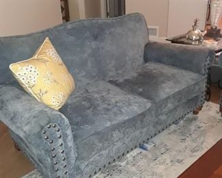 Loveseat upholstered in blue fabric