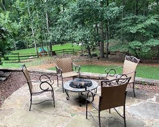 Four outdoor arm chairs and fire pit