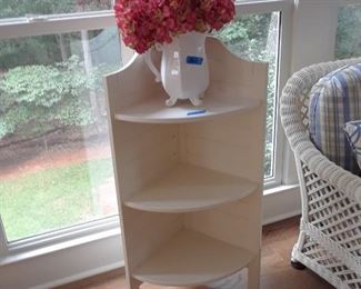 Corner shelf; floral arrangement