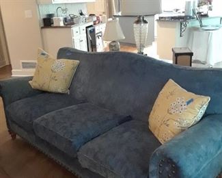 Sofa upholstered in blue fabric