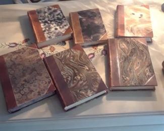 More quatro leather bound books with marblelized boards, circa 1920s