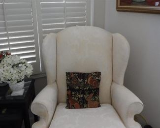 2 white broquaid wing-back chairs.  