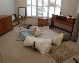Kling full size bed frame, two dressers, two mirrors, one nightstand.  Assorted accent rugs and bedding.
