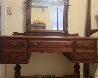 Beautiful antique vanity is immaculate condition. The vanity has 2 drawers on each side and a long center drawer. The mirror tilts to get the best angle.  Measures 44" x 18" x 59". https://ctbids.com/#!/description/share/953373