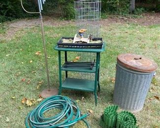 Includes a table, hose, trash can, fencing, sprinkler, wind chime with holder. Tallest item (wind chime with stand) measures 64.5 inches tall. Widest item (table) measures 24 inches across. https://ctbids.com/#!/description/share/953588