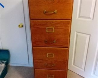4 drawer wooden filing cabinet with brass hardware. Measures 51.5" x 16.5" x 17". https://ctbids.com/#!/description/share/953383