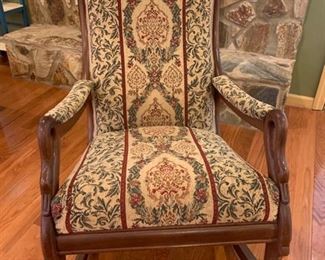 Vintage rocking chair with wood frame. The frame has a swan head and neck on the arm rests and the tapestry fabric is in good condition aside from a few small areas where the threads are loose. 34x25x36” https://ctbids.com/#!/description/share/953520
