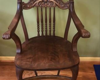 Gorgeous wood chair, appears to be mahogany. Chair has cabriole styled legs and beautiful carvings on arms and chair back. We found a chair very similar to this that is called oak man of the north. It looks like this man is blowing wind. We have found this is called a North Wind Face Carving. The chair possibly pre-dates 1900. You can see the paws at the end of the arms of the chair too.

Chair is in excellent condition and measures 20” x 24” x 36”. https://ctbids.com/#!/description/share/953530