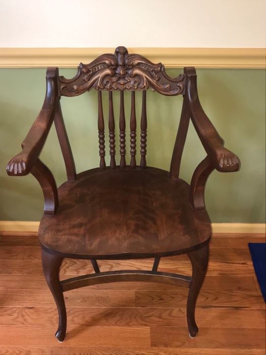 Gorgeous wood chair, appears to be mahogany. Chair has cabriole styled legs and beautiful carvings on arms and chair back. We found a chair very similar to this that is called oak man of the north. It looks like this man is blowing wind. We have found this is called a North Wind Face Carving. The chair possibly pre-dates 1900. You can see the paws at the end of the arms of the chair too.

Chair is in excellent condition and measures 20” x 24” x 36”. https://ctbids.com/#!/description/share/953530