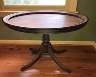 Very nice solid wood oval shaped tea table. Table is in good condition with signs of minor wear. Measures 15” x 27” x 19”. https://ctbids.com/#!/description/share/953534