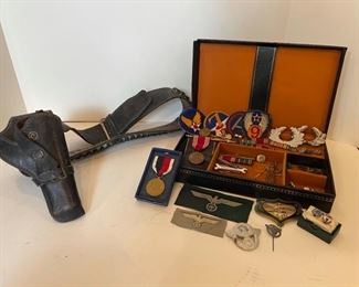 
Collection of military memorabilia. Includes medals, pins ,badges, tie pins, leather holster and more. https://ctbids.com/#!/description/share/953555