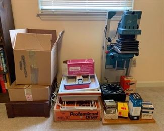 This is a collection of items used in Darkroom development of film and an enlarger made from Beseler, there is also a professional dryer and racks for chemical bins also. https://ctbids.com/#!/description/share/953389