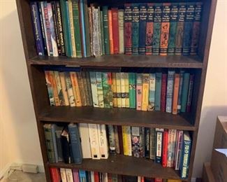 This is a collection of books. The books are both hardbacks and paperbacks. There are kids story books including Cherry Ames, Nancy Drew and Bobbsey Twins. This lot also includes DIY books, educational books and more. Shelf not included. https://ctbids.com/#!/description/share/953388