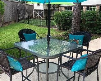 Lovely outdoor/patio table set with four chairs and umbrella 