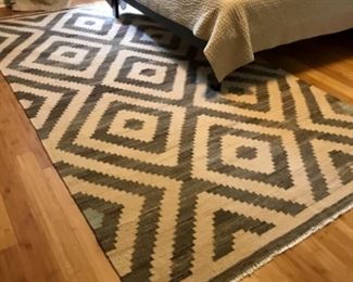 Woven 5’6” x 10’ area rug