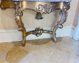 $800 SET
HALLWAY HALF-MOON MARBLE TOP WOOD GOLD TABLE WITH GRAPES
46”L x 15”D x 29”H 
ORNATE FLORAL GOLD MIRROR 
66”L x 41.5”W